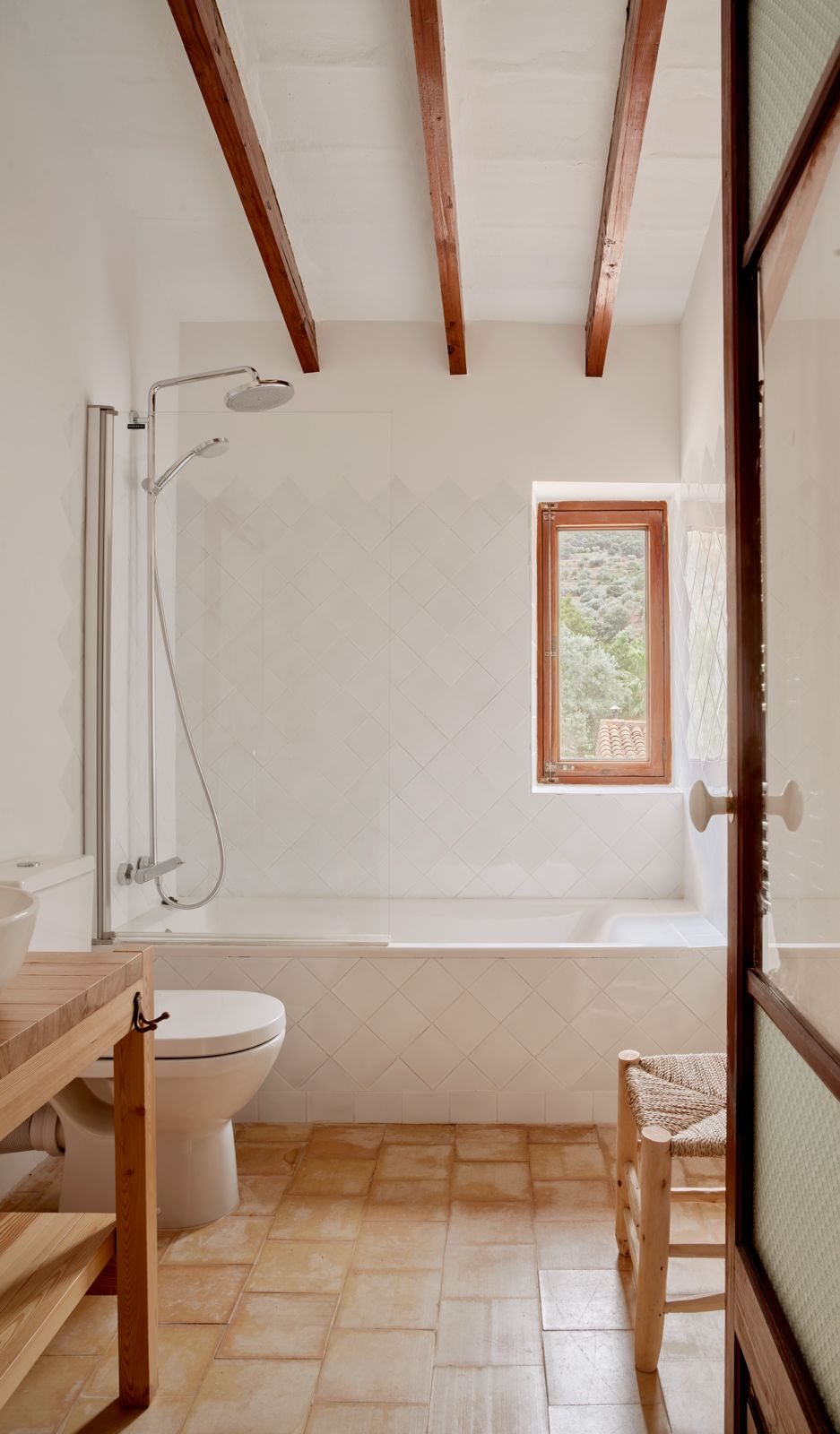 Bathroom with bathtub, shower and wooden window