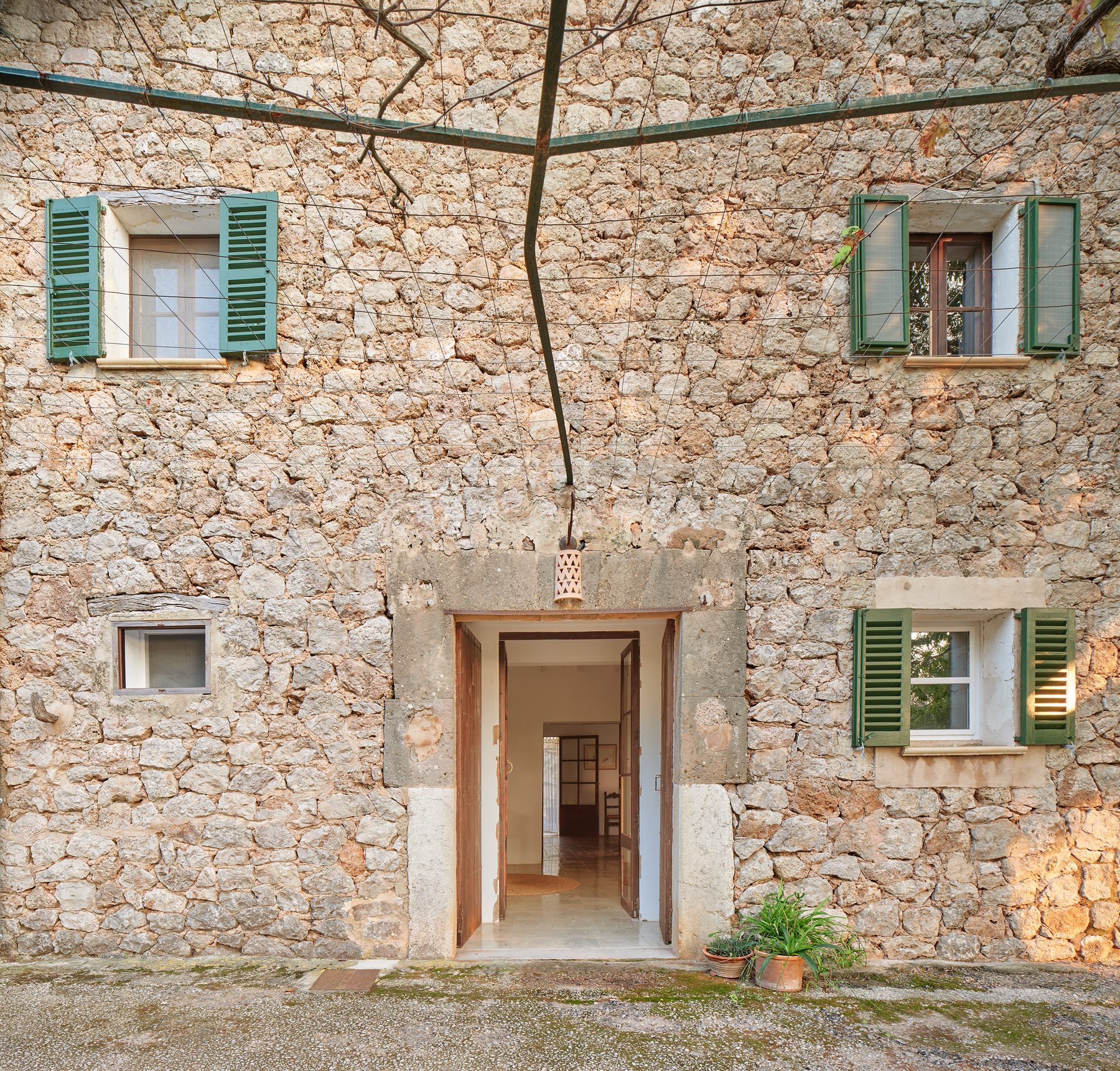 Stone façade with green shutters