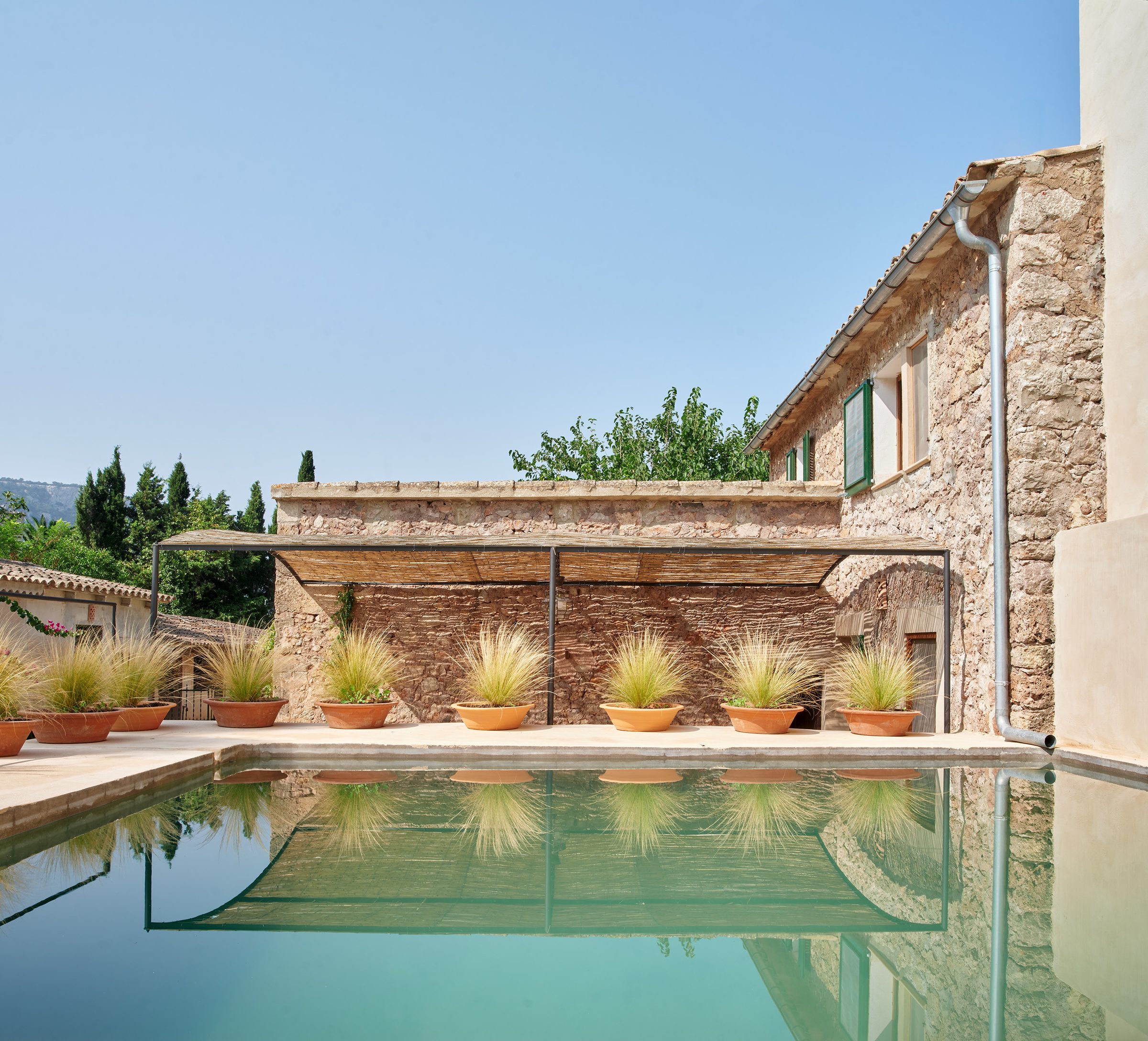 The safareig beside the garden and the main house.